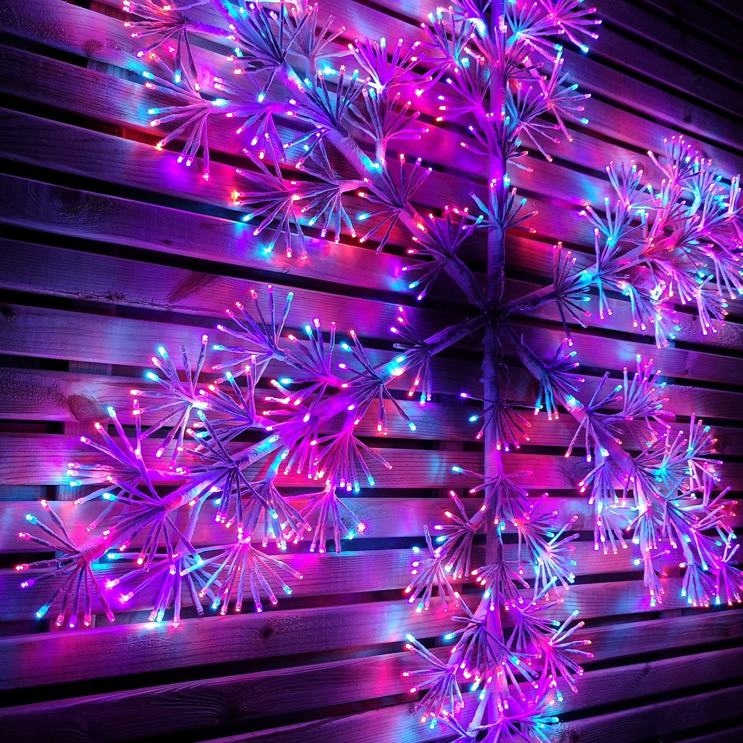 1.2m Twinkling Starburst Snowflake Christmas decoration with 960 Rainbow LEDs