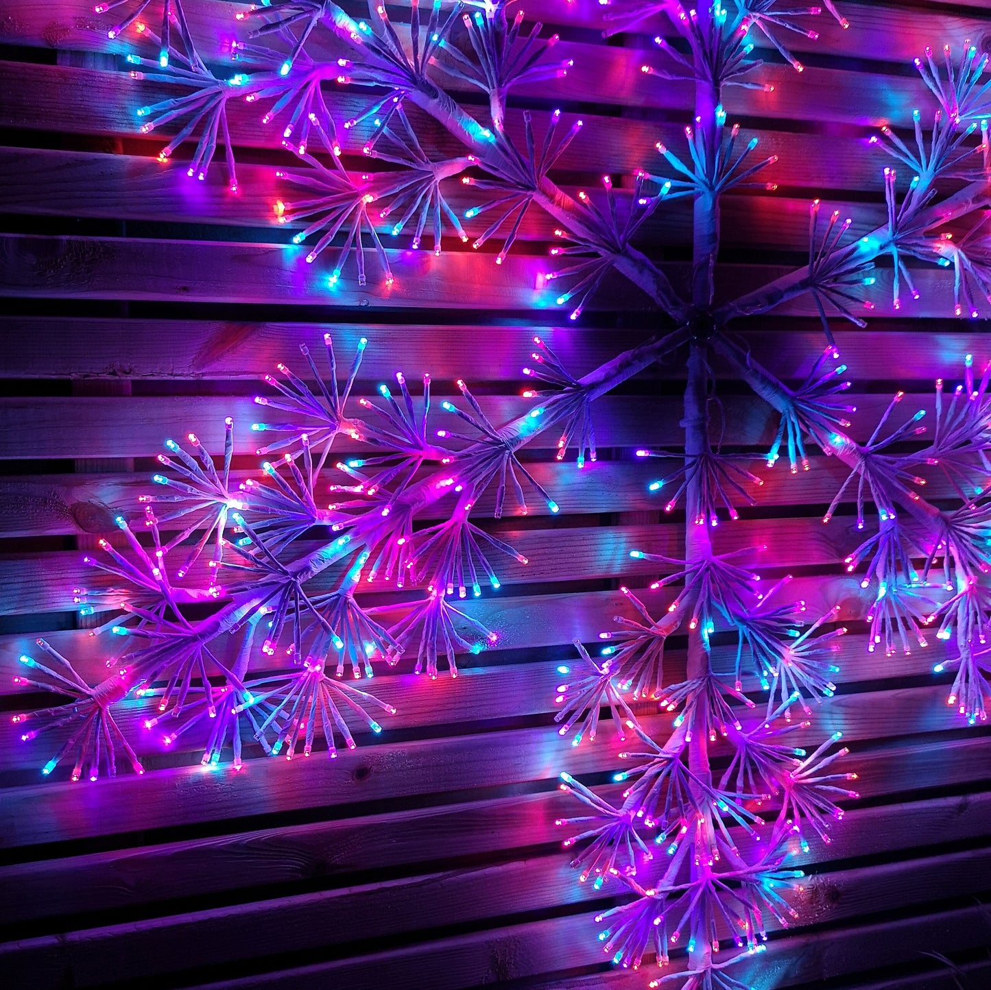 1.2m Twinkling Starburst Snowflake Christmas decoration with 960 Rainbow LEDs