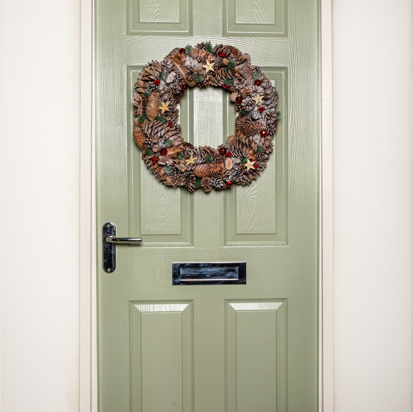 50cm Frosted Hanging Christmas Wreath with Red Jingle Bells & Wooden Stars