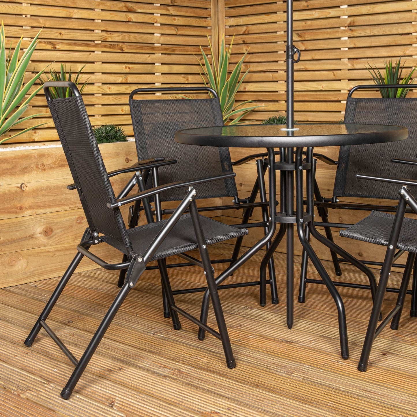 Samuel Alexander Outdoor 4 Seater Round Glass Top Table and Chairs Patio Set with Parasol in Black