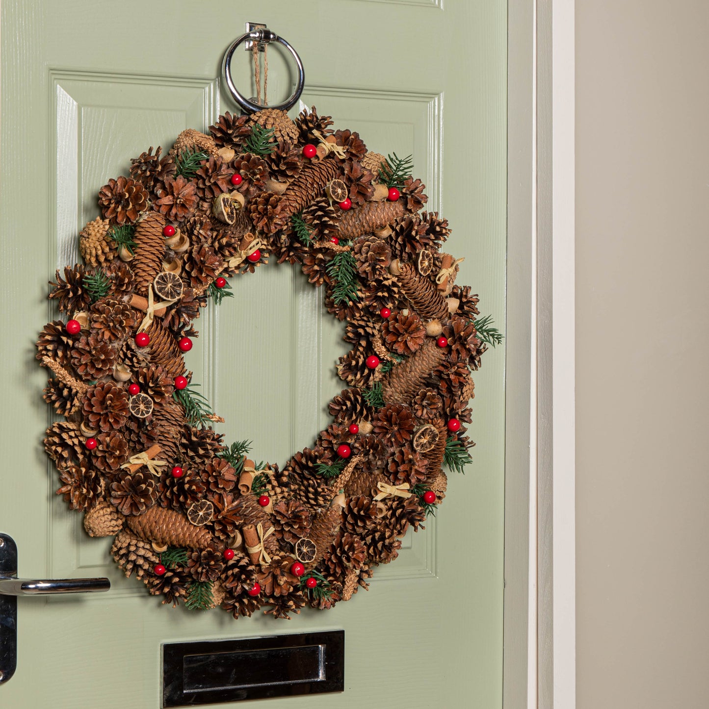 60cm Winter Spice Hanging Christmas Wreath with Pine Cones Red Berries & Dried Fruit