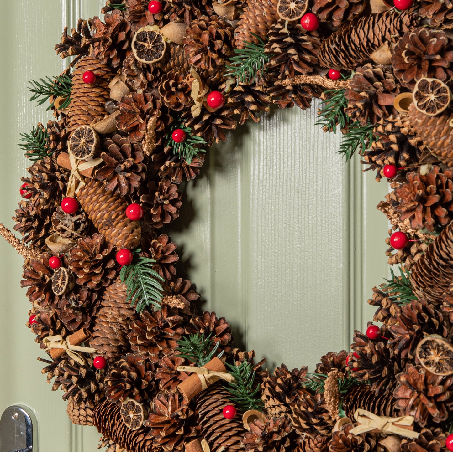 60cm Winter Spice Hanging Christmas Wreath with Pine Cones Red Berries & Dried Fruit