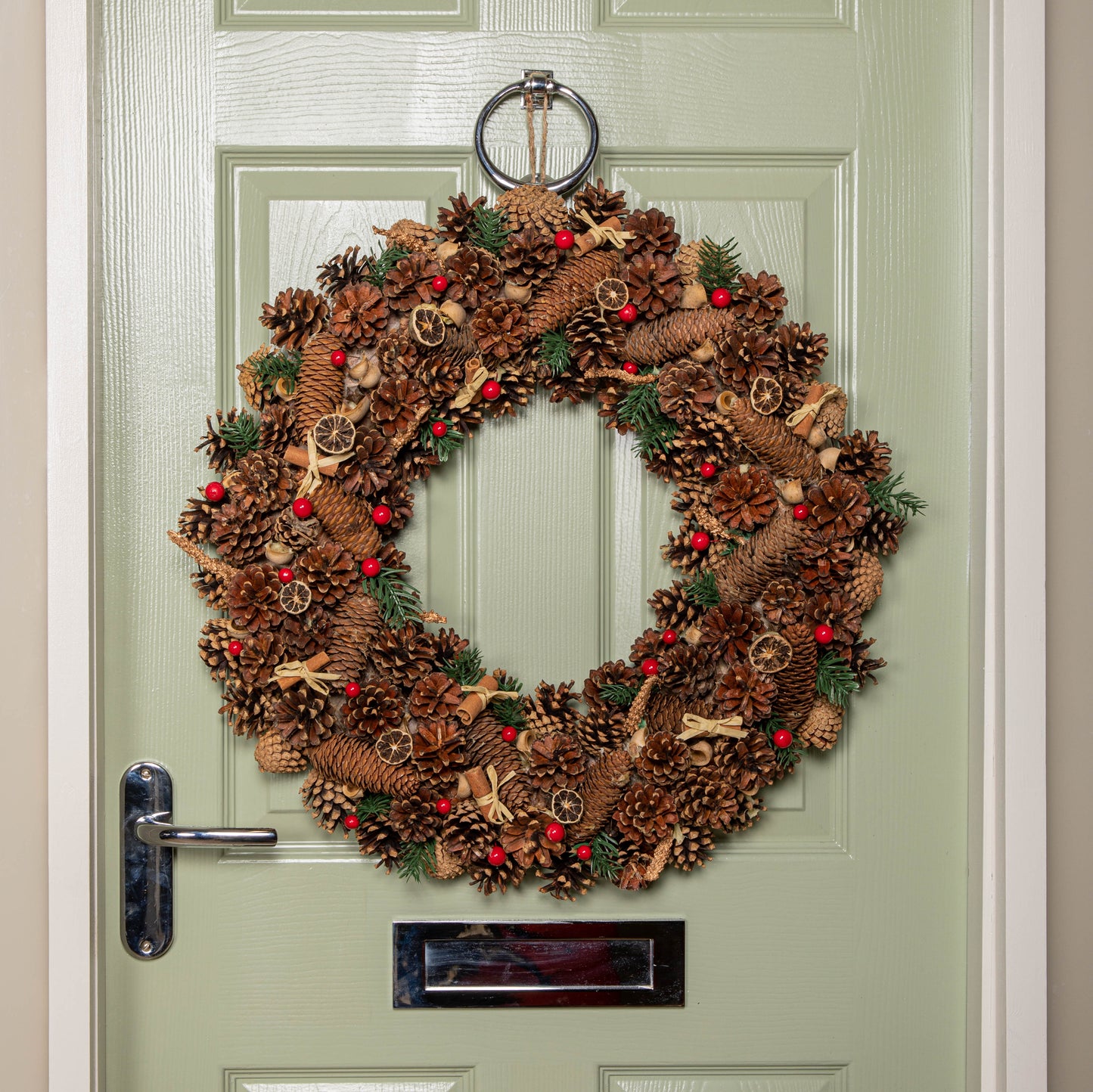 60cm Winter Spice Hanging Christmas Wreath with Pine Cones Red Berries & Dried Fruit