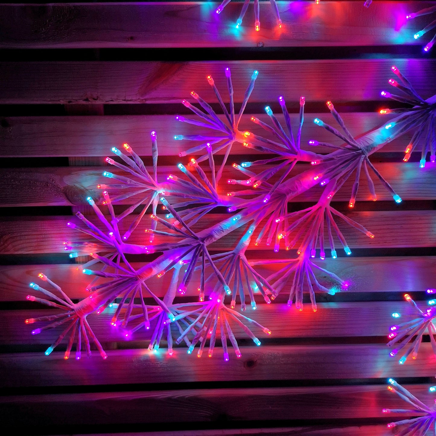 1.2m Twinkling Starburst Snowflake Christmas decoration with 960 Rainbow LEDs