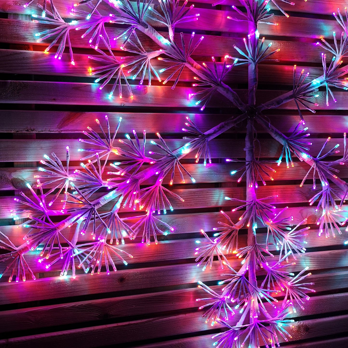 1.2m Twinkling Starburst Snowflake Christmas decoration with 960 Rainbow LEDs