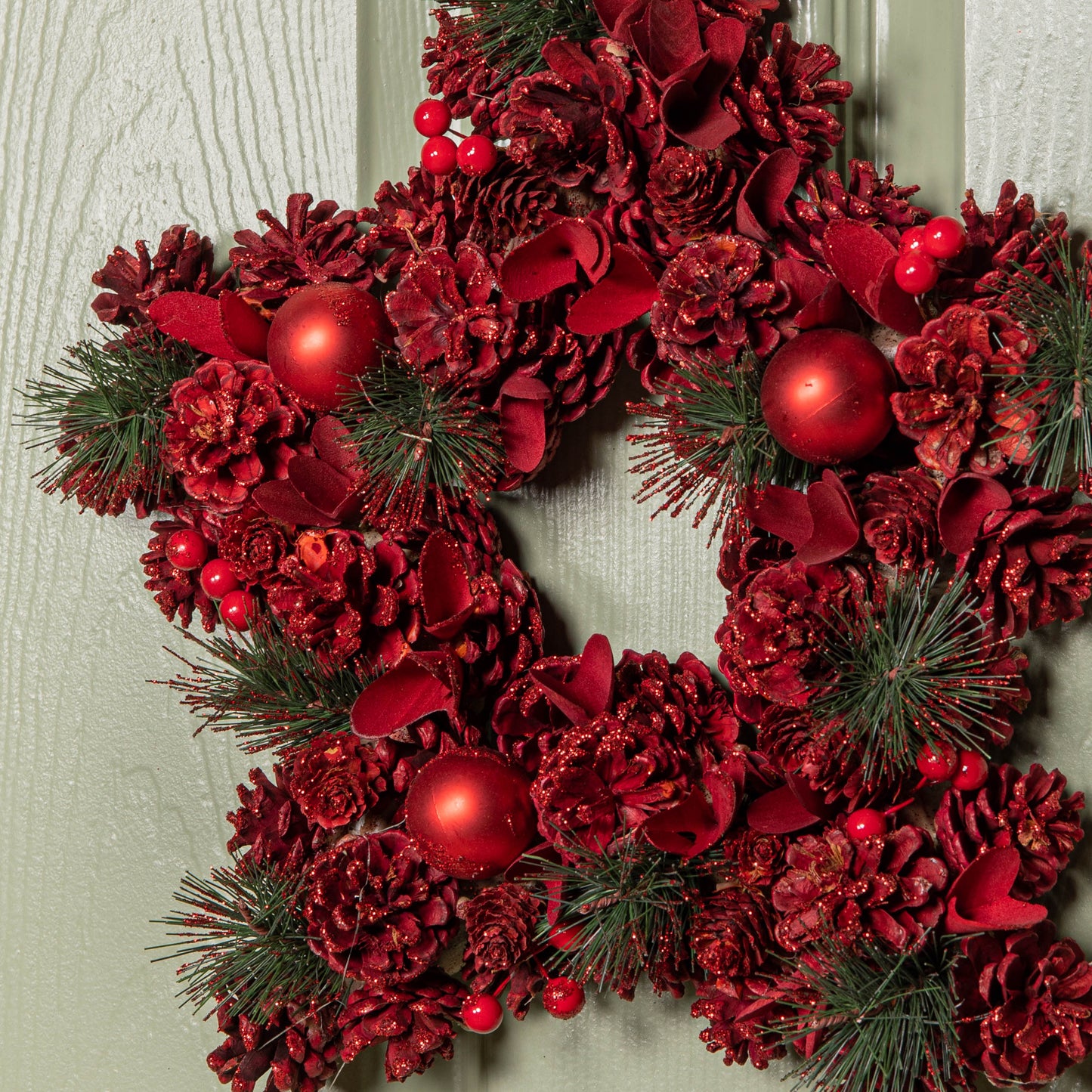 35cm Ruby Pine Hanging Christmas Star Wreath with Red Pinecones and Berries