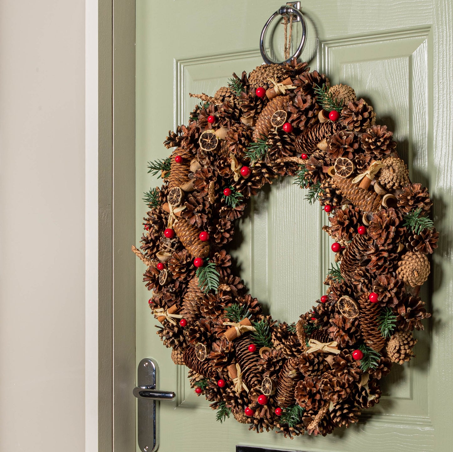 60cm Winter Spice Hanging Christmas Wreath with Pine Cones Red Berries & Dried Fruit