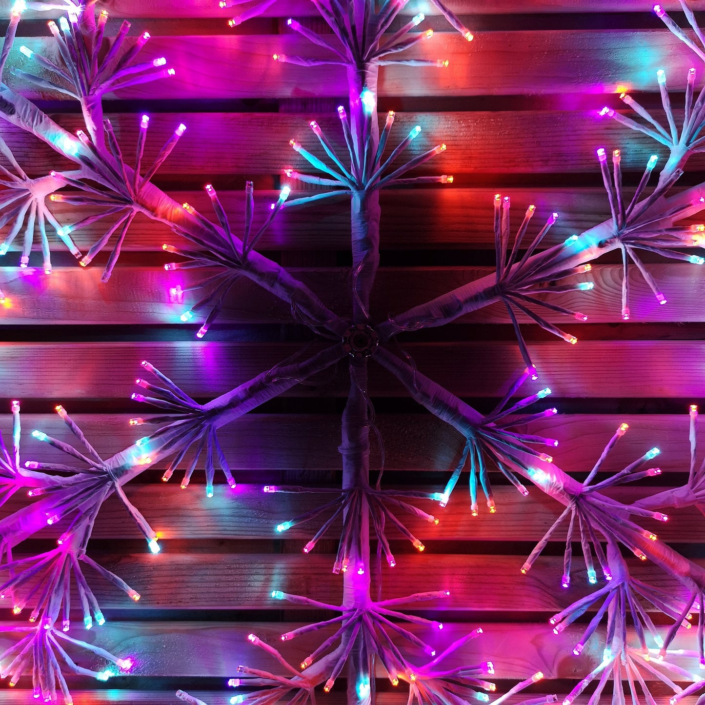 1.2m Twinkling Starburst Snowflake Christmas decoration with 960 Rainbow LEDs