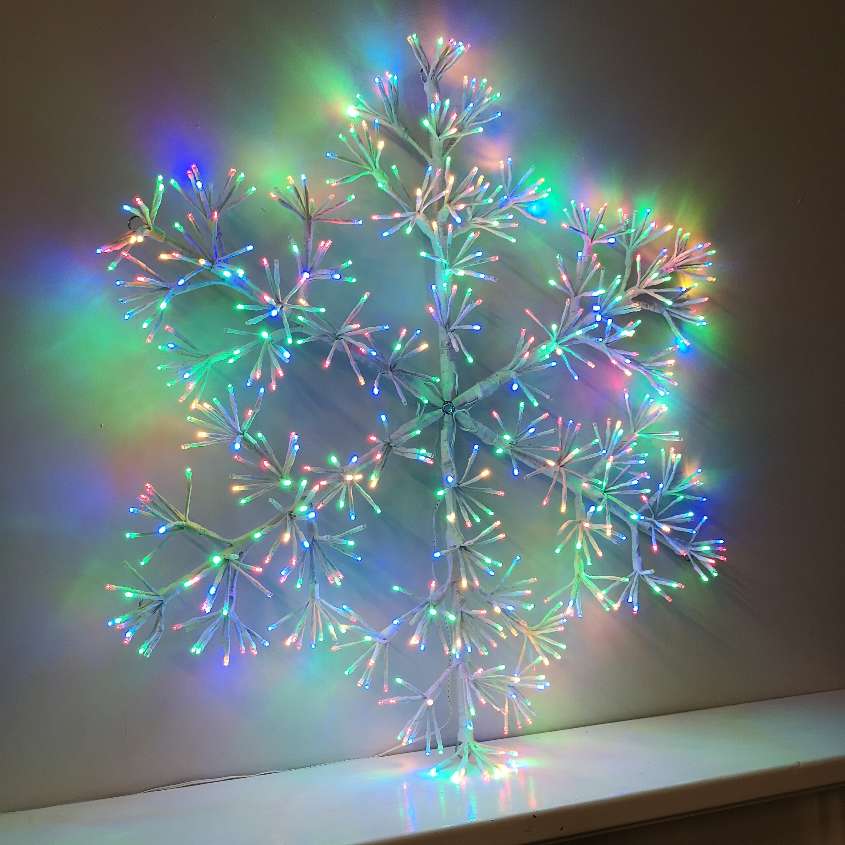 90cm Premier White Starburst Snowflake Christmas Decoration with Twinkling LEDs in Multicoloured
