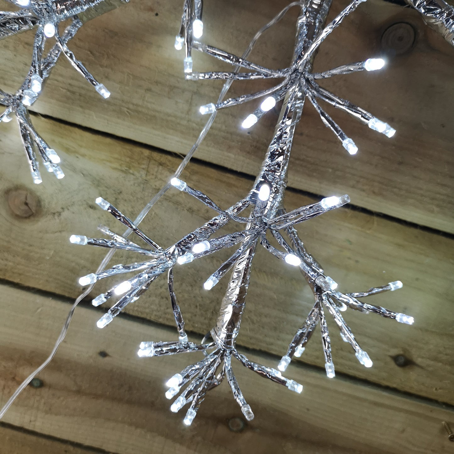 Premier 60cm Silver Starburst Snowflake Wall Window Decoration with 300 Warm White LEDs