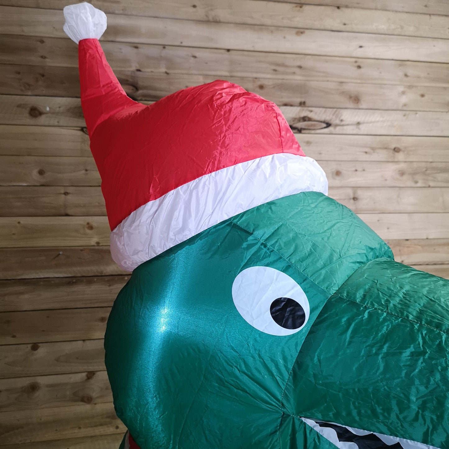 2.1m Premier Christmas Indoor Outdoor LED Inflatable T Rex Dinosaur in Santa Hat with Parcel